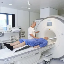 A person lying on a hospital bed