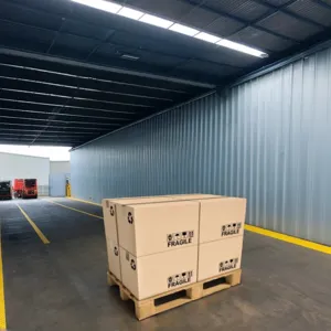 A warehouse with several trucks