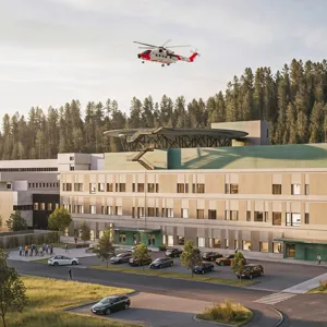 Skisse av et nytt sykehus med adkomst og et helikopter i luften
