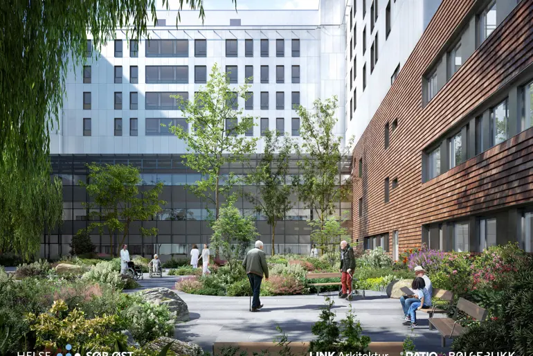 Perspektiv mot pasienthagen med beplantning og benker