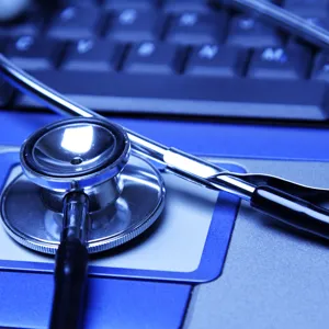 Stetoskop på bærbar pc