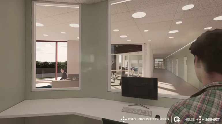 En person som sitter i et rom