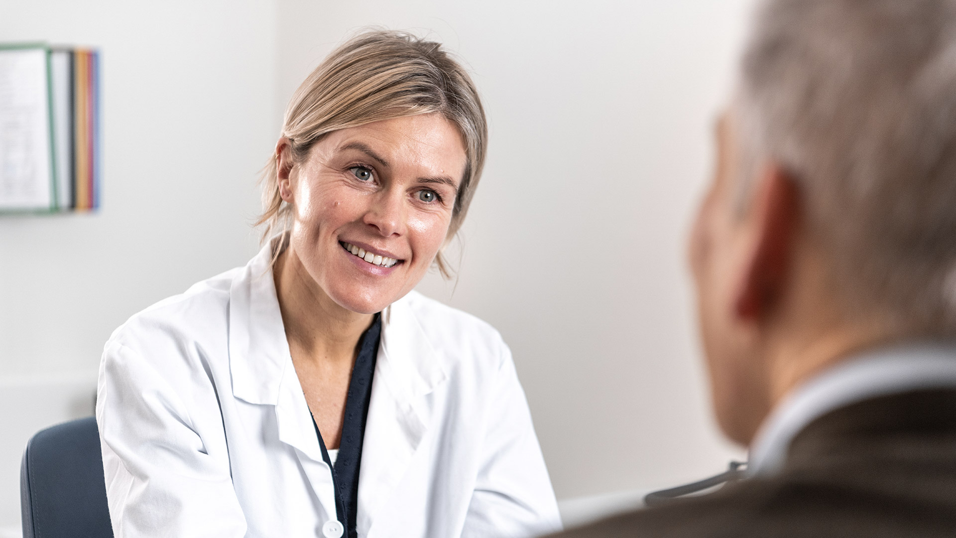 A doctor talking to a patient