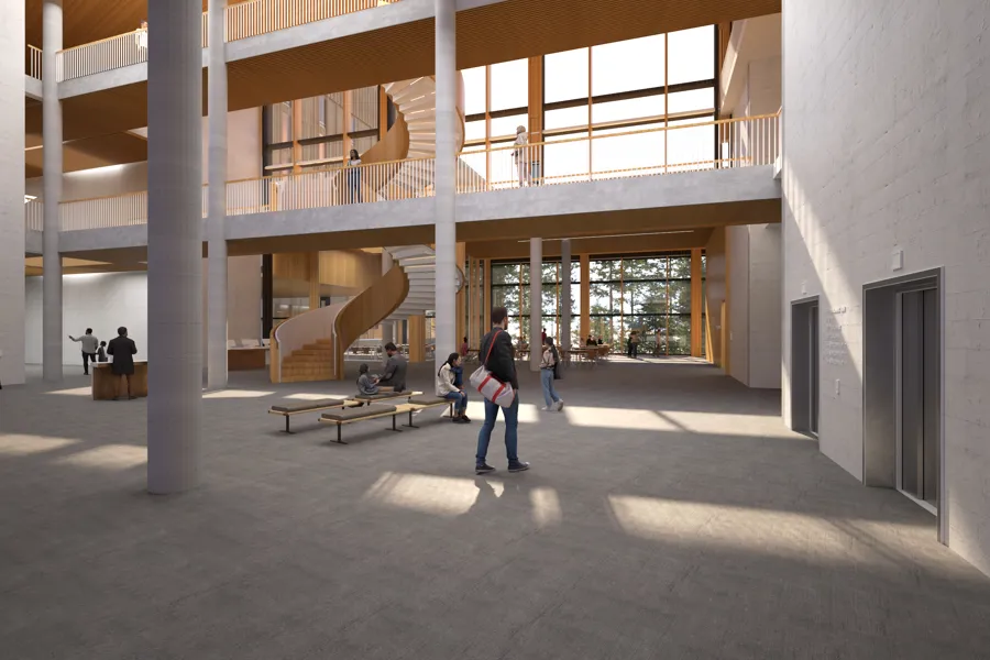 En gruppe mennesker som går i en bygning