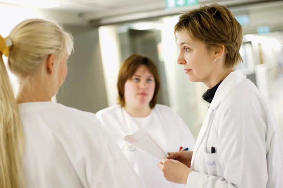 En gruppe kvinner i hvite frakker